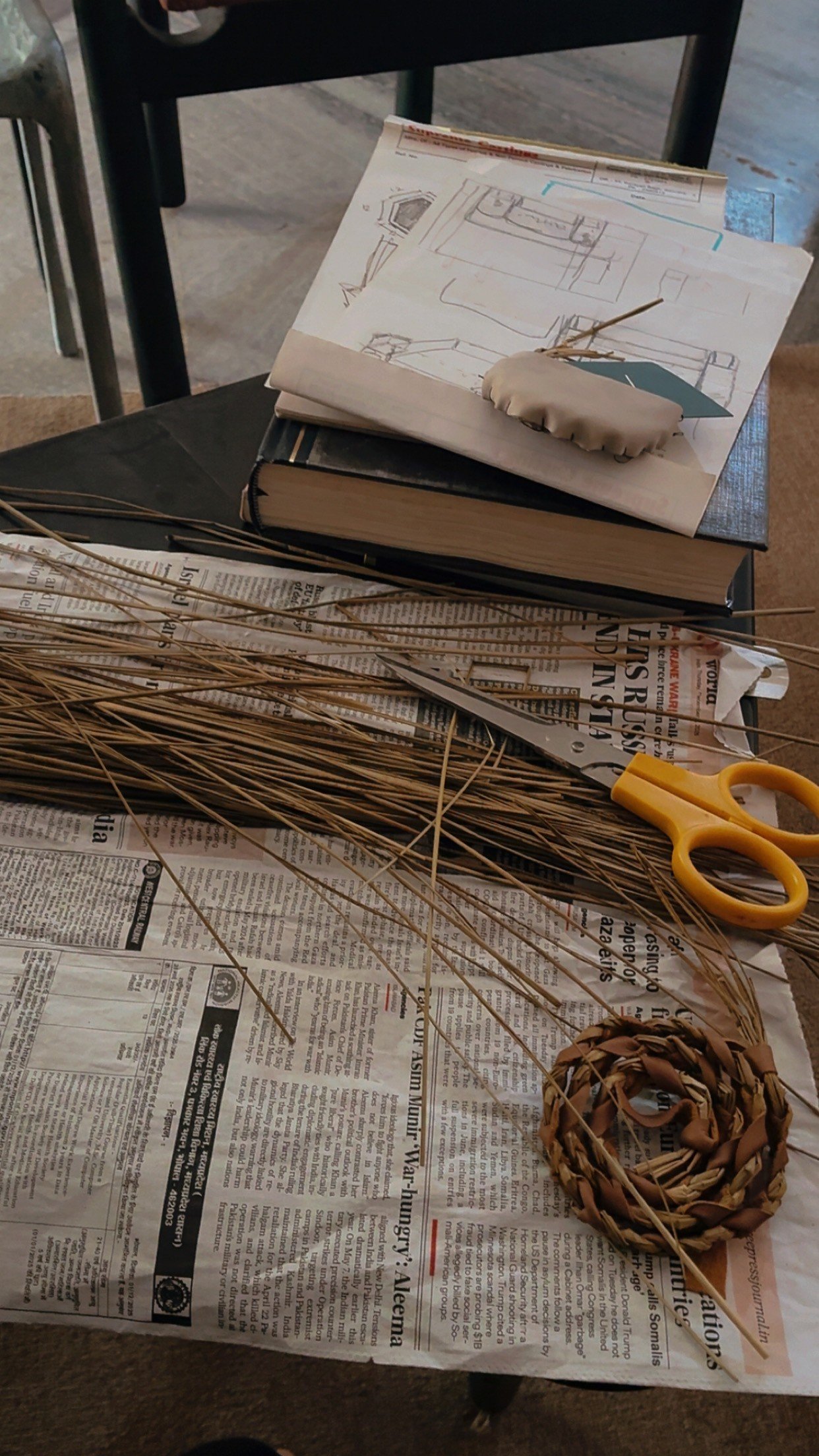 Design workbench with material swatches, craft scissors, and design notes